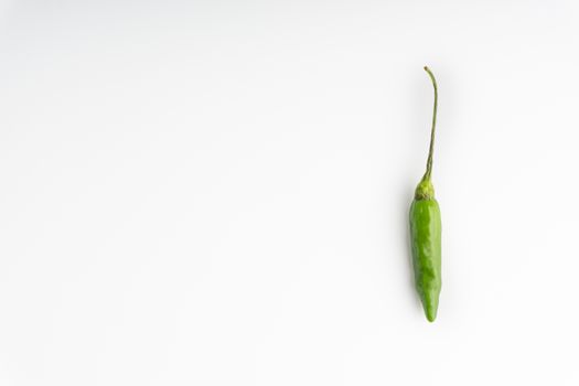 Green BirdÕs eye chili,Thai Chili pepper ,bird chili pepper nature isolate on white background. Selective focus and crop fragment