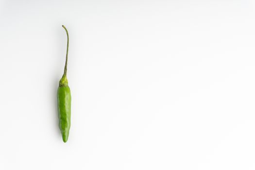 Green BirdÕs eye chili,Thai Chili pepper ,bird chili pepper nature isolate on white background. Selective focus and crop fragment