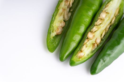 Green BirdÕs eye chili,Thai Chili pepper ,bird chili pepper nature isolate on white background. Selective focus and crop fragment