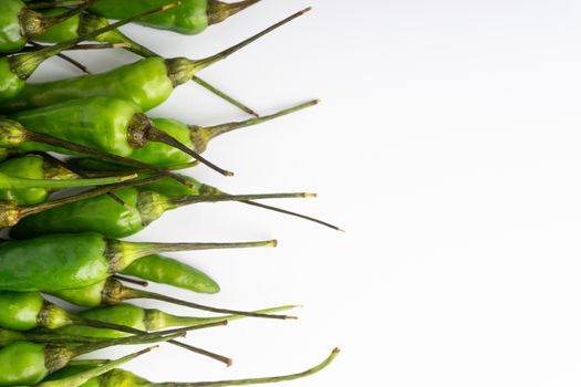 Green BirdÕs eye chili,Thai Chili pepper ,bird chili pepper nature isolate on white background. Selective focus and crop fragment