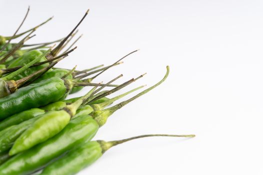 Green BirdÕs eye chili,Thai Chili pepper ,bird chili pepper nature isolate on white background. Selective focus and crop fragment