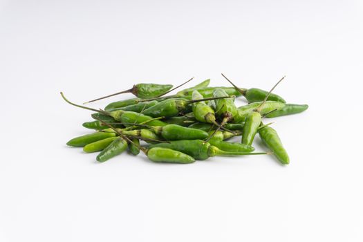 Green BirdÕs eye chili,Thai Chili pepper ,bird chili pepper nature isolate on white background. Selective focus and crop fragment