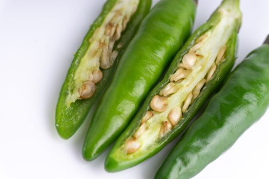 Green BirdÕs eye chili,Thai Chili pepper ,bird chili pepper nature isolate on white background. Selective focus and crop fragment