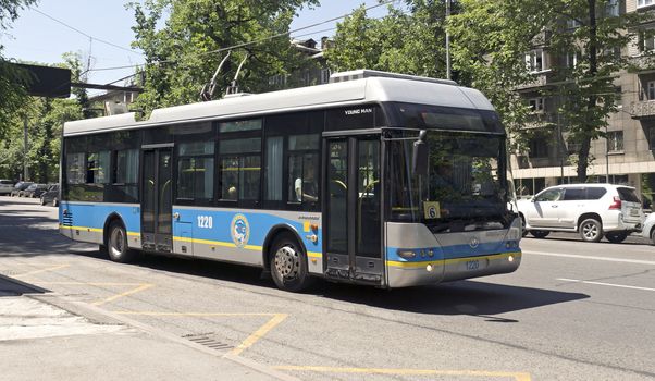 ALMATY, KAZAKHSTAN - JUNE 19, 2015: People ride Neoplan trolleybus in Almaty, Kazakhstan. Neoplan is part of MAN SE which had 1.28 billion EUR operating income in 2010.

Almaty, Kazakhstan - June 19, 2015: People ride Neoplan trolleybus in Almaty, Kazakhstan. Neoplan is part of MAN SE which had 1.28 billion EUR operating income in 2010.