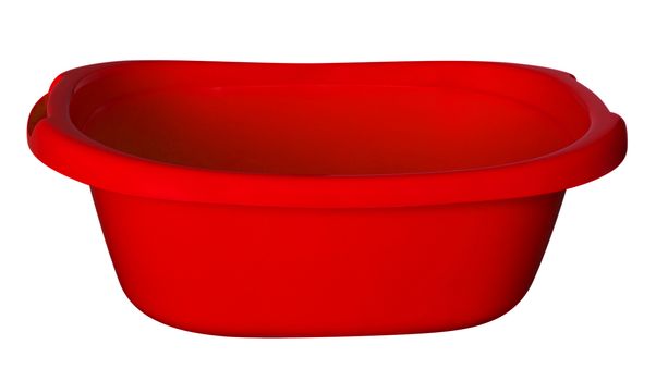 Empty red baby plastic bath tub isolated on white. Clipping path included.