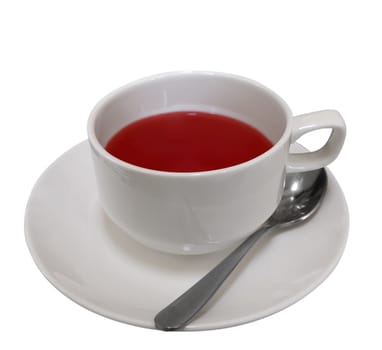 Cup of red fruit tea isolated on white. Clipping path included.