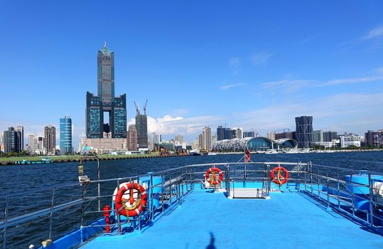KAOHSIUNG, TAIWAN -- MAY 14, 2017. Kaohsiung City waterfront with the Tuntex Tower and the exhibition center viewed from a ship
