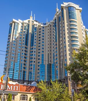 ALMATY, KAZAKHSTAN - OCTOBER 20, 2015: Multi-storey residential complex "Capital Center" is located in the historic city of Almaty. The complex is composed of three 23-storey buildings.

Almaty, Kazakhstan - October 20, 2015: View of Almaty city. Multi-storey residential complex "Capital Center" is located in the historic city of Almaty. The complex is composed of three 23-storey buildings.