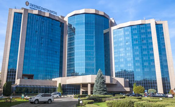 ALMATY, KAZAKHSTAN - OCTOBER 21, 2015: The InterContinental Hotel is located near Republic Square and the Presidential Palace in Almaty.

Almaty, Kazakhstan - October 21, 2015: The InterContinental Hotel is located near Republic Square and the Presidential Palace in Almaty. InterContinental Hotels and Resorts - the international hotel chain, owned by the British company InterContinental Hotels Group. People are standing near the hotel.
