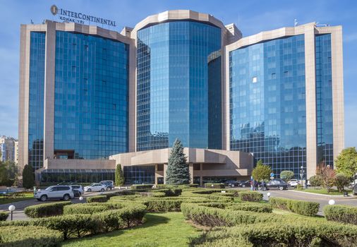 ALMATY, KAZAKHSTAN - OCTOBER 21, 2015: The InterContinental Hotel is located near Republic Square and the Presidential Palace in Almaty.

Almaty, Kazakhstan - October 21, 2015: The InterContinental Hotel is located near Republic Square and the Presidential Palace in Almaty. InterContinental Hotels and Resorts - the international hotel chain, owned by the British company InterContinental Hotels Group. People are standing near the hotel.