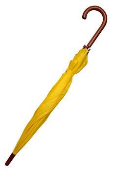 Folded yellow umbrella isolated on white background. Clipping path included.