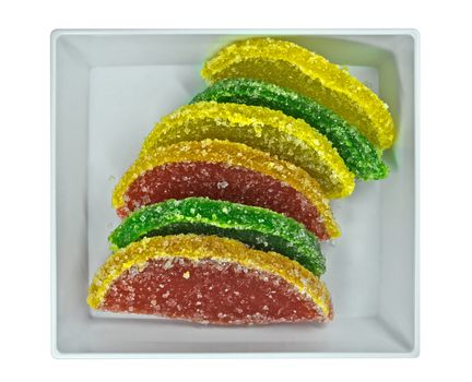 Colorful jujube jelly candies on the dish isolated on white. Clipping path included.
