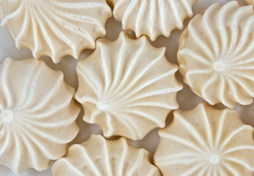 French vanilla meringue cookies close up background.