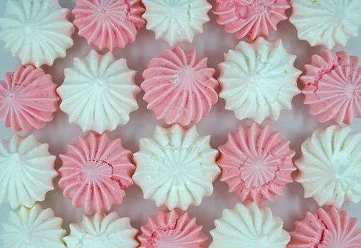 French vanilla meringue cookies close up background.