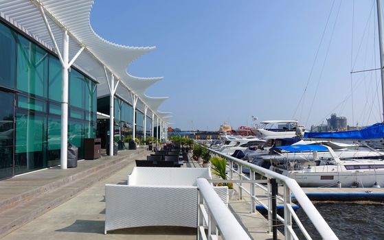 KAOHSIUNG, TAIWAN -- MAY 13, 2018: View of the Kaohsiung yacht harbor with its adjacent restaurant and coffee shop.
