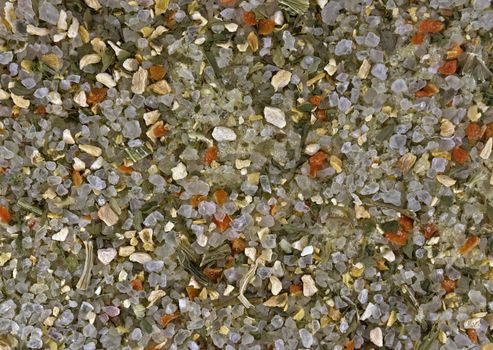Sea salt with dry grass and spices background.