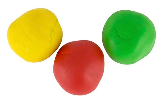 Color plasticine balls isolated on a white background. Clipping path included.