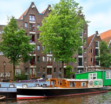 View of Amsterdam canals and typical dutch houses.