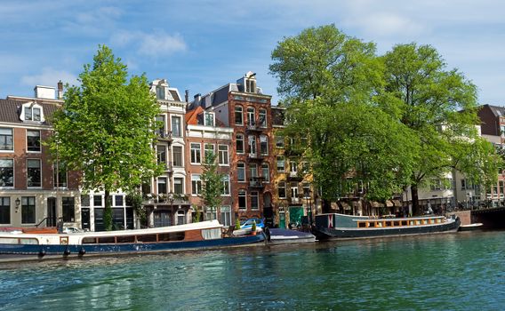 View of Amsterdam canals and typical dutch houses. Holland.