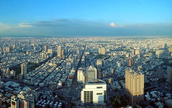 KAOHSIUNG, TAIWAN -- JULY 13, 2014:  A birds eye view of Kaohsiung City in Taiwan from west to east