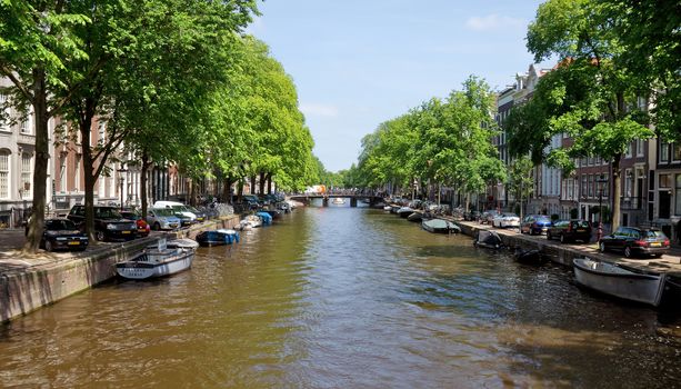 AMSTERDAM, NETHERLANDS - MAY 30: Amsterdam canals on May 30, 2014 in Amsterdam, Netherlands. View of Amsterdam canals and typical dutch houses.

Amsterdam, Netherlands - May 30, 2014: View of Amsterdam canals and typical dutch houses.