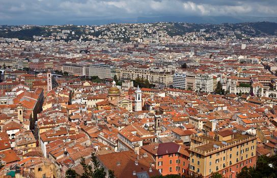 NICE, FRANCE - MAY 31, 2014: Wonderful panoramic view with colorful historical houses of the old city.

Nice, France - May 31, 2014: Wonderful panoramic view with colorful historical houses of the old city.