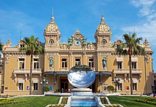 MONTE CARLO, MONACO - JUNE 1: Front of the Grand Casino on June 1, 2014 in Monte Carlo, Monaco. The Casino is one of the most notable buildings in Principality. 

Monte Carlo, Monaco - June 1, 2014: Front of the Grand Casino. The Casino is one of the most notable buildings in Principality. People are walking before and after visiting a Casino.