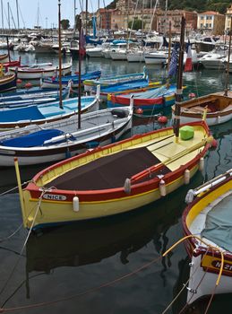 NICE, FRANCE - MAY 31, 2014: Colorful boats and buildings within a Port de Nice. Port de Nice was started in 1745.

Nice, France - May 31, 2014: Colorful buildings and boats within a Port de Nice in French Riviera. Port de Nice was started in 1745.