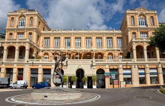 GRASSE, FRANCE - JUNE 2, 2014: Palace of Congresses. Previously, there was placed in the casino Belle Epoque. This building was built in the XVIII century. Grasse is a town in the French department of Alpes-Maritimes. City known for its perfume industry. The city was founded in the XI century.

Grasse, France - June 2, 2014: Palace of Congresses. Previously, there was placed in the casino Belle Epoque. This building was built in the XVIII century. Grasse is a town in the French department of Alpes-Maritimes. City known for its perfume industry. The city was founded in the XI century.
