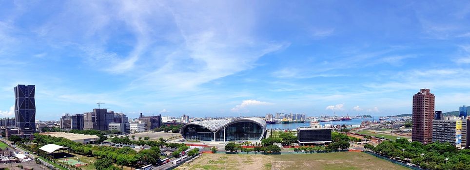 KAOHSIUNG, TAIWAN -- JUNE 11, 2015: A panoramic view of Kaohsiung port with the new exhibition center in the center foreground.
