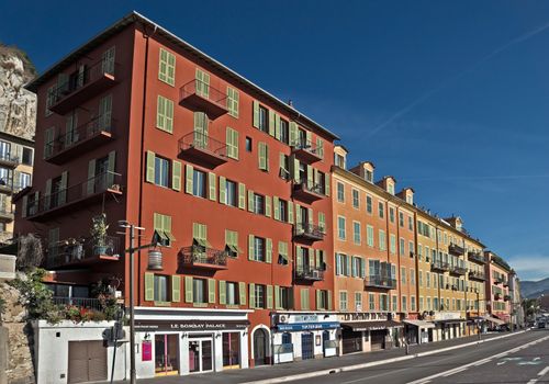 NICE, FRANCE - JUNE 5, 2014: Architecture along Promenade des Anglais. Promenade des Anglais is a symbol of the Cote d'Azur and was built in 1830 at the expense of the British colony.

Nice, France - June 5, 2014: Architecture along Promenade des Anglais. Promenade des Anglais is a symbol of the Cote d'Azur and was built in 1830 at the expense of the British colony.