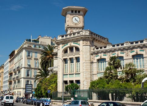 NICE, FRANCE - JUNE 4, 2014: Architecture along Promenade des Anglais. Promenade des Anglais is a symbol of the Cote d'Azur and was built in 1830 at the expense of the British colony.

Nice, France - June 4, 2014: Architecture along Promenade des Anglais. Promenade des Anglais is a symbol of the Cote d'Azur and was built in 1830 at the expense of the British colony. People are walking by street.