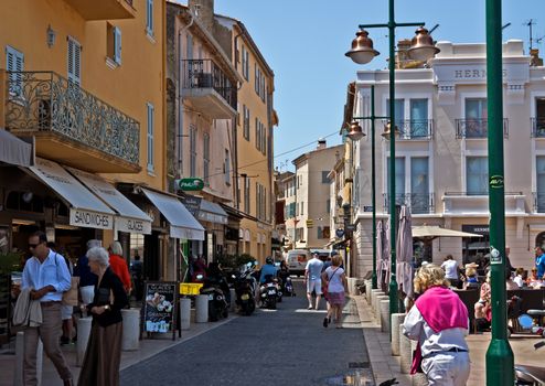 SAINT TROPEZ, FRANCE - JUNE 5, 2014: Architecture of Saint Tropez city in French Riviera, France.

Saint Tropez, France - June 5, 2014: Architecture of Saint Tropez city in French Riviera, France. People are walking by street.