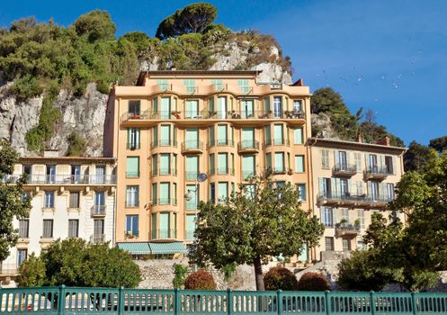 NICE, FRANCE - JUNE 5, 2014: Architecture along Promenade des Anglais. Promenade des Anglais is a symbol of the Cote d'Azur and was built in 1830 at the expense of the British colony.

Nice, France - June 5, 2014: Architecture along Promenade des Anglais. Promenade des Anglais is a symbol of the Cote d'Azur and was built in 1830 at the expense of the British colony.