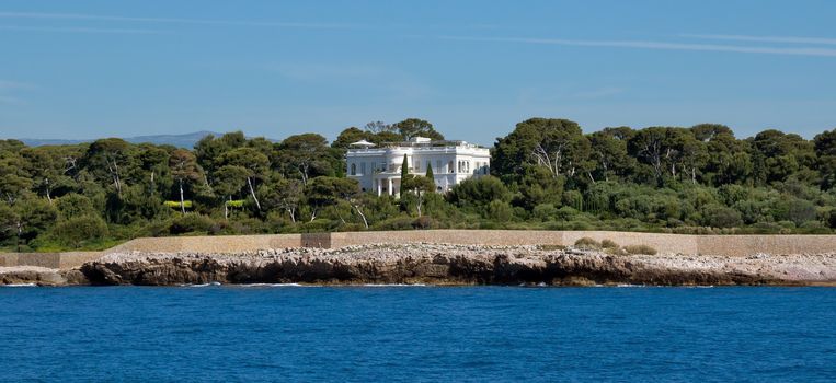 ANTIBES, FRANCE - JUNE 5, 2014: A luxury villa on the shores of the Mediterranean Sea.

Antibes, France - June 5, 2014: A luxury villa on the shores of the Mediterranean Sea.