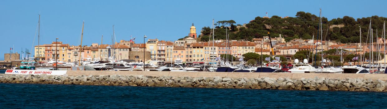 SAINT TROPEZ, FRANCE - JUNE 5: Panoramic view of the city of Saint Tropez on June 5, 2014 in Saint Tropez, France. An overview of the glamorous city of Saint Tropez on the cote d'azur. 

Saint Tropez, France - June 5, 2014: Panoramic view of the city of Saint Tropez. An overview of the glamorous city of Saint Tropez on the cote d'azur.