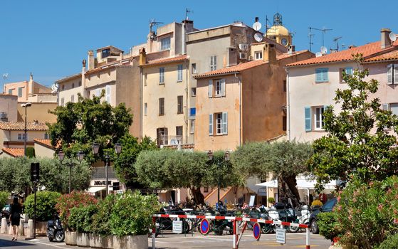 SAINT TROPEZ, FRANCE - JUNE 5, 2014: Architecture of Saint Tropez city in French Riviera, France.

Saint Tropez, France - June 5, 2014: Architecture of Saint Tropez city in French Riviera, France. People are walking by street and are resting in caffee.