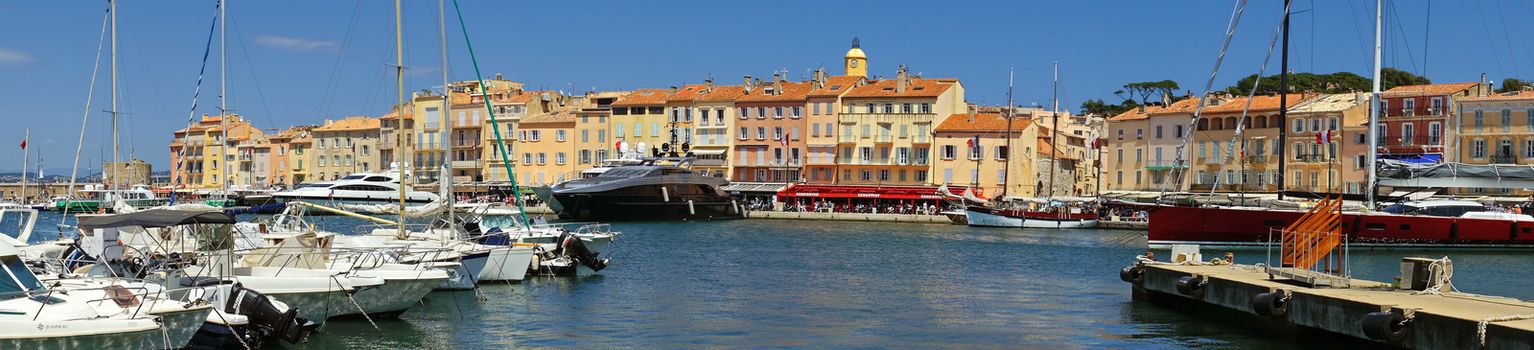 SAINT TROPEZ, FRANCE - JUNE 5: Panoramic view of the city of Saint Tropez on June 5, 2014 in Saint Tropez, France. An overview of the glamorous city of Saint Tropez on the cote d'azur. 

Saint Tropez, France - June 5, 2014: Panoramic view of the city of Saint Tropez. An overview of the glamorous city of Saint Tropez on the cote d'azur.