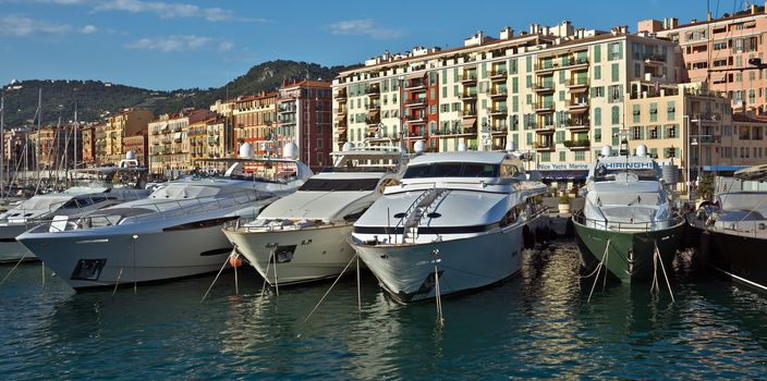 NICE, FRANCE - JUNE 5, 2014: Yachts in the Port de Nice in French Riviera. Port de Nice was started in 1745.

Nice, France - June 5, 2014: Yachts in the Port de Nice in French Riviera. Port de Nice was started in 1745.