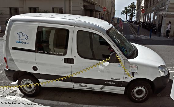 NICE, FRANCE - JUNE 6, 2014: Smart electric drive cars charging at on-street stations.

Nice, France - June 6, 2014: Smart electric drive cars charging at on-street stations. Electric car charging on a street in the center of Nice.