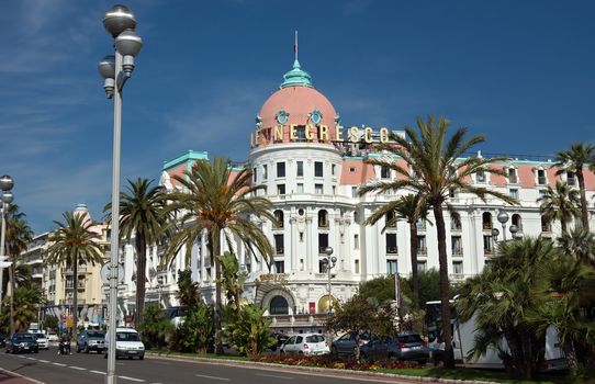 NICE, FRANCE - JUNE 6, 2014: Luxury Hotel Negresco on English Promenade in Nice, French Riviera. Hotel Negresco is the famous luxury hotel on the Promenade des Anglais in Nice, a symbol of the Cote d'Azur.

Nice, France - June 6, 2014: Luxury Hotel Negresco on English Promenade in Nice, French Riviera. Hotel Negresco is the famous luxury hotel on the Promenade des Anglais in Nice, a symbol of the Cote d'Azur.