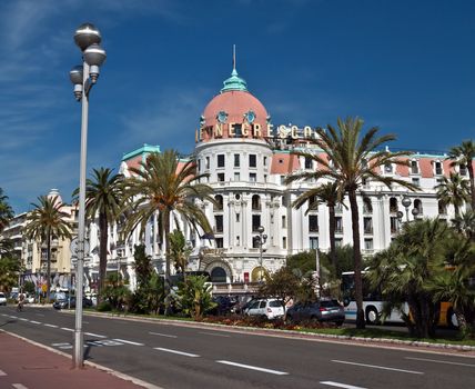 NICE, FRANCE - JUNE 6, 2014: Luxury Hotel Negresco on English Promenade in Nice, French Riviera. Hotel Negresco is the famous luxury hotel on the Promenade des Anglais in Nice, a symbol of the Cote d'Azur.

Nice, France - June 6, 2014: Luxury Hotel Negresco on English Promenade in Nice, French Riviera. Hotel Negresco is the famous luxury hotel on the Promenade des Anglais in Nice, a symbol of the Cote d'Azur.