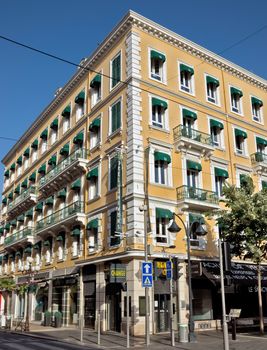 NICE, FRANCE - JUNE 8, 2014: Architecture along Promenade des Anglais. Promenade des Anglais is a symbol of the Cote d'Azur and was built in 1830 at the expense of the British colony.

Nice, France - June 8, 2014: Architecture along Promenade des Anglais. Promenade des Anglais is a symbol of the Cote d'Azur and was built in 1830 at the expense of the British colony.