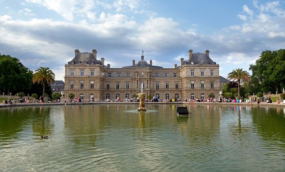 The Luxembourg Palace in The Jardin du Luxembourg in Paris, France. View on the main facade and water pond. Many people are resting there.

PARIS, FRANCE - JUNE 8: The Luxembourg Palace in The Jardin du Luxembourg on June 8, 2014 in Paris, France. View on the main facade and water pond. Many people are resting there.

Paris, France - June 8, 2014: The Luxembourg Palace in The Jardin du Luxembourg. View on the main facade and water pond. Many people are resting there.