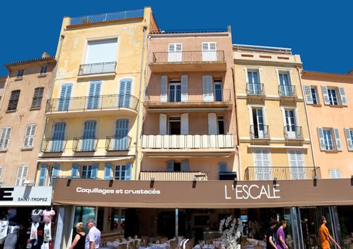 SAINT TROPEZ, FRANCE - JUNE 5, 2014: Architecture of Saint Tropez city in French Riviera, France.

Saint Tropez, France - June 5, 2014: Architecture of Saint Tropez city in French Riviera, France. People are walking by street.