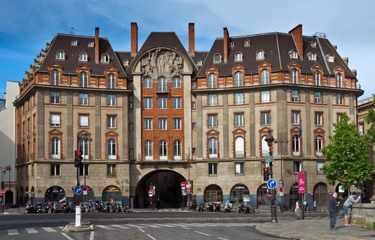 PARIS, FRANCE - JUNE 9, 2014: View of the typical french architecture.

Paris, France - June 9, 2014: View of the typical french architecture. People are standing and are taking photos.