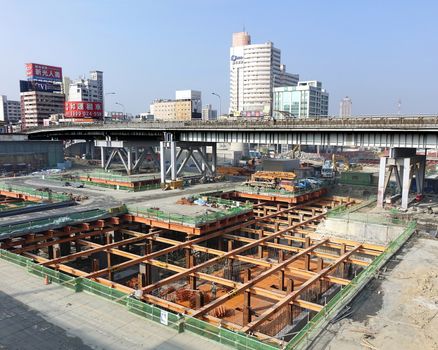 KAOHSIUNG, TAIWAN -- NOVEMBER 2, 2014:  A large underground construction project outside Kaohsiung Railway Station, that is part of the new light rail system.