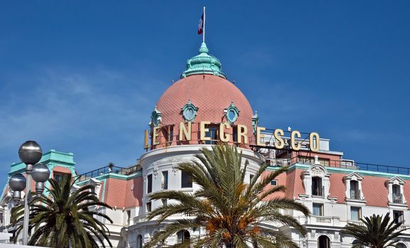 NICE, FRANCE - JUNE 6, 2014: Luxury Hotel Negresco on English Promenade in Nice, French Riviera. This is the famous luxury hotel on the Promenade des Anglais in Nice, a symbol of the Cote d'Azur.

Nice, France - June 6, 2014: Luxury Hotel Negresco on English Promenade in Nice, French Riviera. Hotel Negresco is the famous luxury hotel on the Promenade des Anglais in Nice, a symbol of the Cote d'Azur.