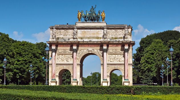 Triumphal Arch (Arc de Triomphe du Carrousel) at Tuileries gardens in Paris, France. Monument was built between 1806-1808 to commemorate Napoleon's military victories.