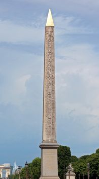 The iconic Obelisk of Luxor, the ancient Egyptian stone monument at the site of the revolutionary guillotine in the centre of the Place de la Concorde in Paris, France.